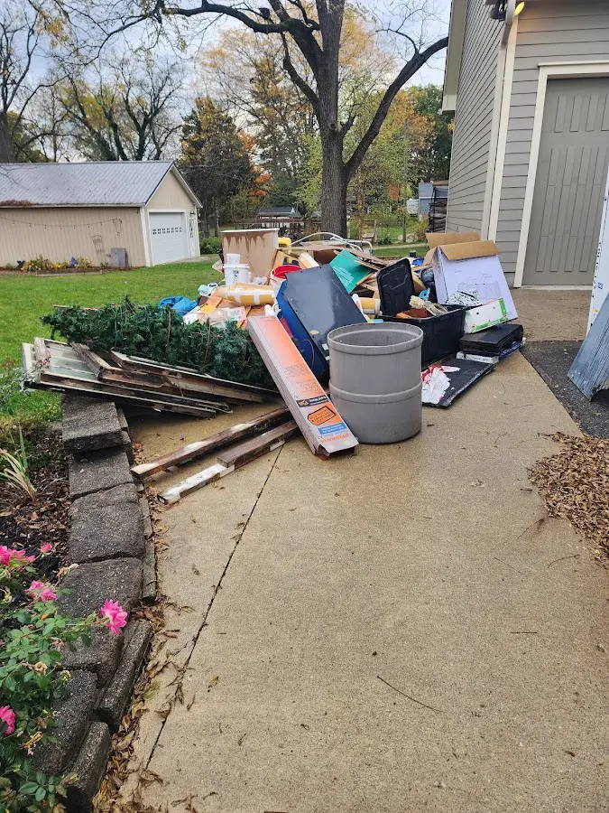 Dumpster being loaded with debris for Residential Dumpster Rental in Dalhart